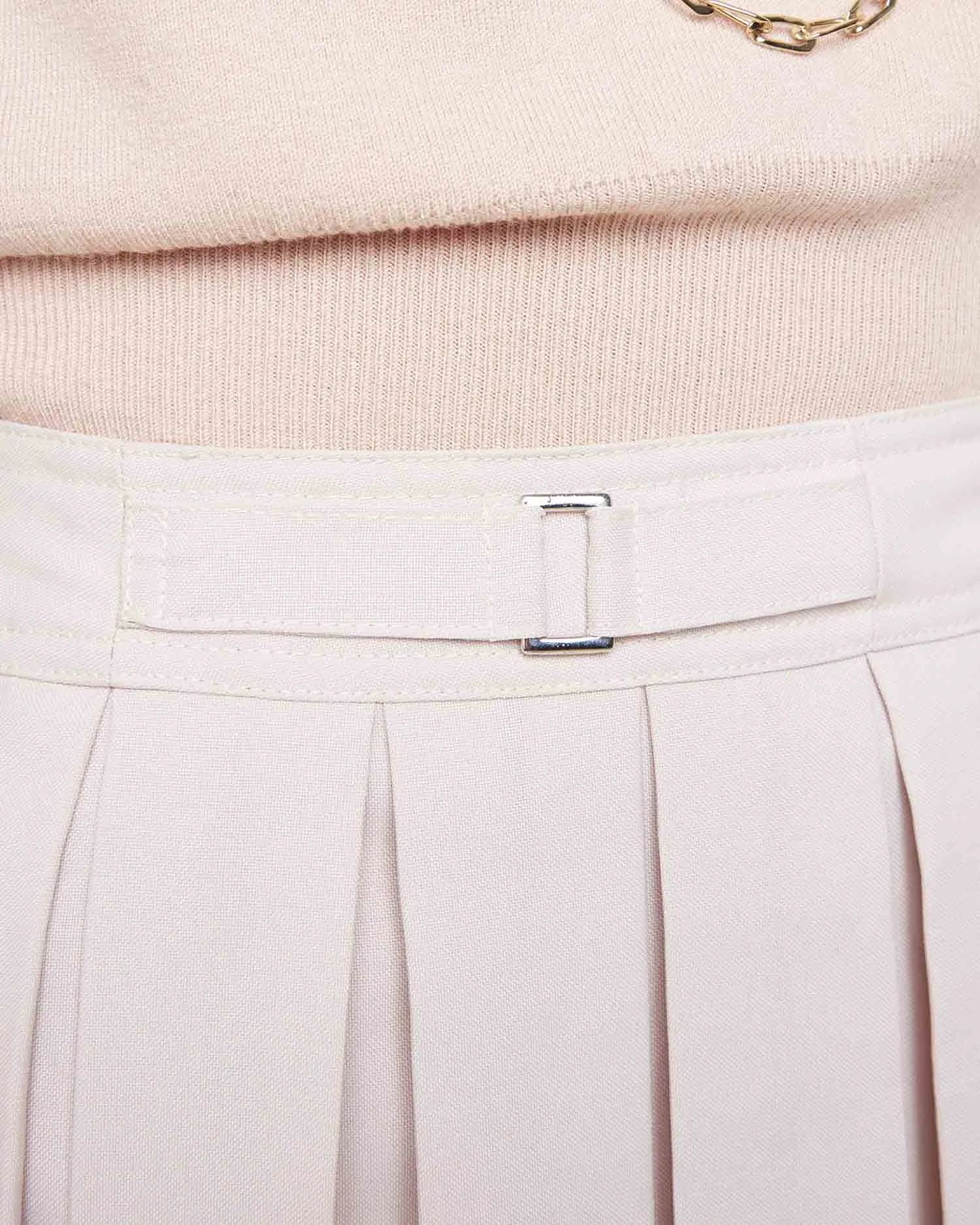 Asymmetric pleated skirt
